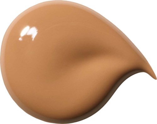En beige droppformad vätskesplats med en mörkare skugga längst ner.
