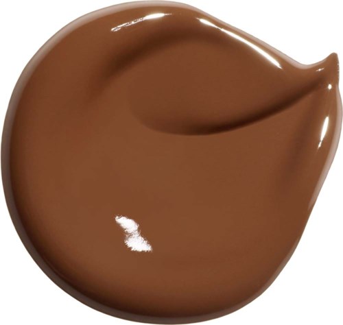 En klick chokladsmörja med glansig, slät yta och en liten curlform.