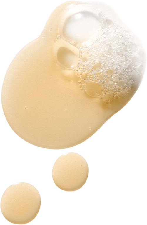 Cream and foam splash with two small round shapes below.