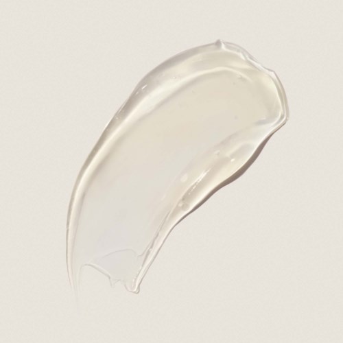 Clear gel with a smooth, shiny surface, shaped like a teardrop on a light background.
