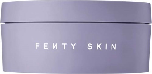 Ett runt, ljuslila förpackning med orden "FEITY SKIN" på, troligen en hudvårdsprodukt.