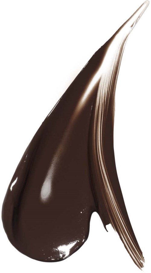 En virvel av glänsande, mörk choklad med en krämig textur och ett streck på sidan.