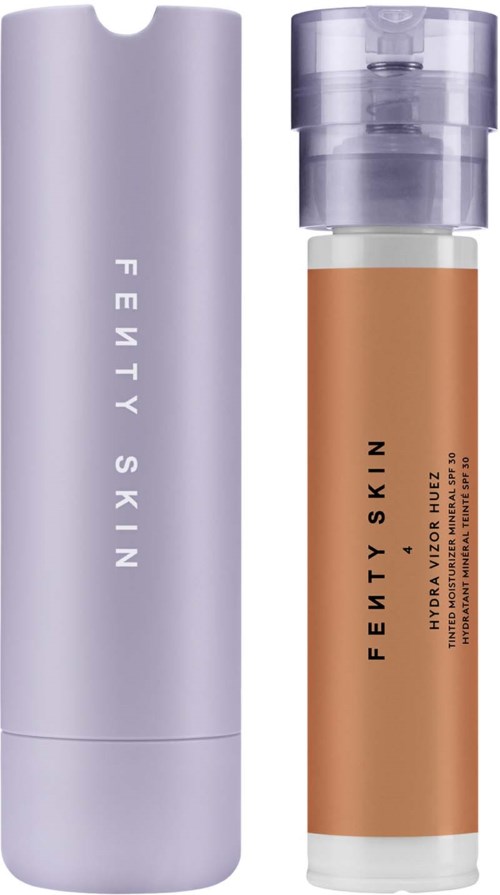 Two skincare products: a tall purple bottle and a smaller clear bottle with liquid inside.