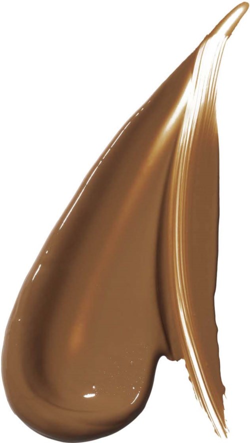 En stor klick av chokladspread visas, glänsande och slät, med en avsmalnande spets.