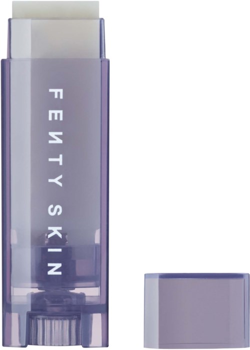 En hudvårdsproduktbehållare med orden "FRETTY SKIN" på framsidan, lila och vita färger, och ett lock.