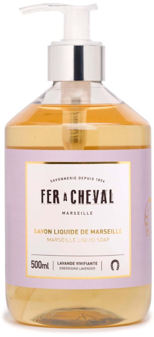 A clear bottle with a pump contains lavender liquid soap from Marseille, labeled 'Fer à Cheval' with lavender scent.