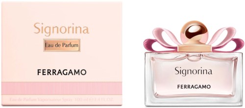 Ein Parfümflakon mit rosa Schleifen und rundem Verschluss, beschriftet 'Signorina' von Ferragamo, neben seinem Karton.