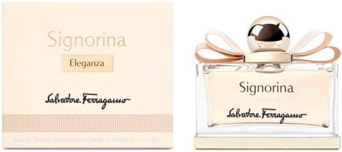 Ein Parfümflasche und Verpackung mit dem Namen Signorina Eleganza, goldene und beige Farben, und eine Schleifen-Dekoration.
