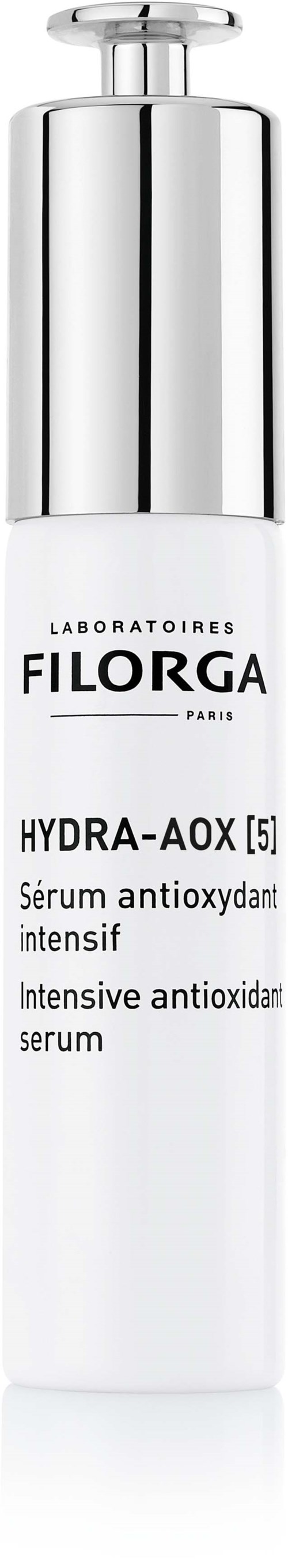 En vit och silverfärgad flaska med hudvårdssyremedel, märkt Filorga Hydra-Aox antioxidant serum.