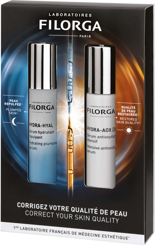 Box with two skincare serums, one for dull skin and one for radiant, healthy skin, in sleek bottles with silver caps.