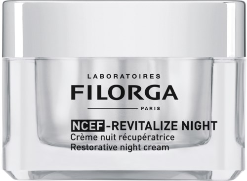 En liten, tydlig burk med nattkräm med vit lock, märkt 'Filorga NCEF-Revitailze Night.'