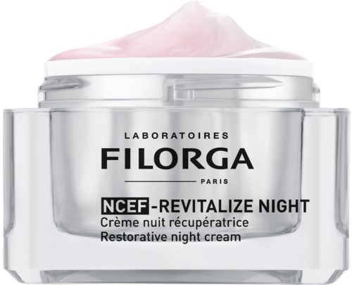 En burk nattkräm med rosa kräm på toppen, märkning 'Filorga NCEF-Reviatlize Night' från parisiska laboratorier.