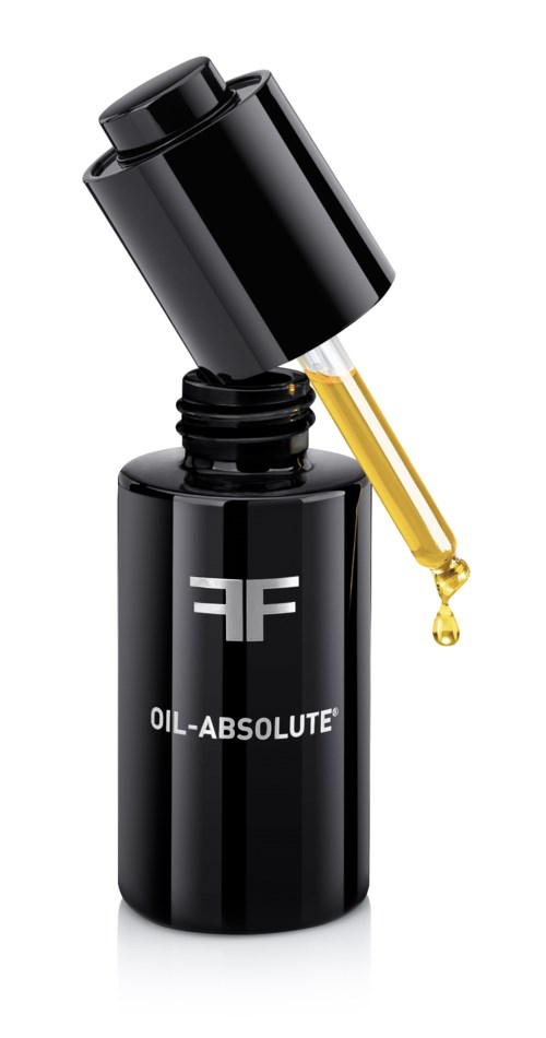 En svart flaska med pipett, märkt "OIL-ABSOLUTE," med en gul droppe olja som faller.