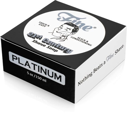 Musta ja valkoinen saippuapakkaus, jossa lukee 'Platinum', ja siinä on vintage-hahmo ja tuotemerkki 'The 21st Century Shave Soap.'
