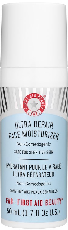 En hvit flaske merket 'Ultra Repair Face Moisturizer' med rød og svart tekst og en sirkel logo øverst.