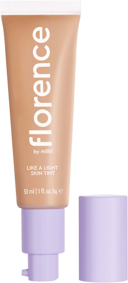 A skin tint tube labeled 'Florence by mills' with purple cap, promotes a light skin look.