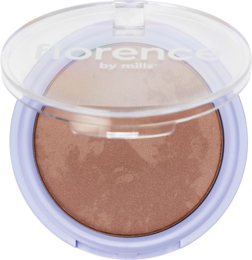 Ein Make-up-Kompakt mit lilafarbenem Gehäuse und transparentem Deckel, enthält Bronzer oder Rouge.