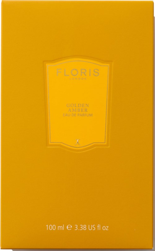 Żółte opakowanie z tekstem o perfumie Floris Golden Amber, 100 ml, w prostym języku.