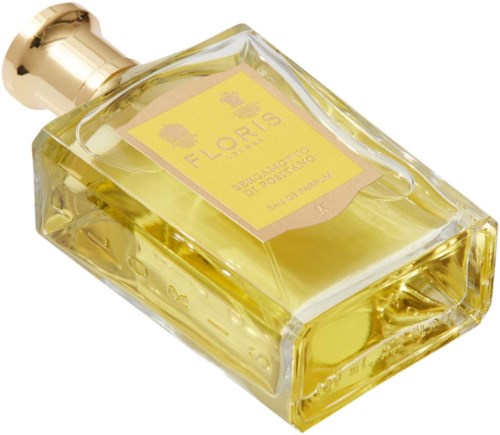 Butelka perfum z żółtym płynem i złotą zakrętką, oznakowana Flouris, Biologico, Portugalia, 100 ml.