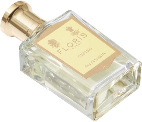 En tydlig glasparfymflaska med guldlock och beige etikett, märkt Floris, Cépiro, Eau de Toilette.