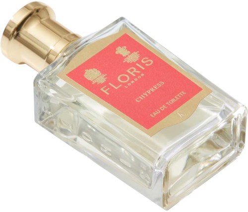 Mała butelka perfum z złotą nakrętką i czerwoną etykietą, na której napisano Floris, Cypress, Eau de Toilette.