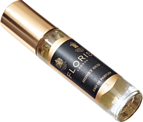 Kleine Glasparfümflasche mit schwarzem und goldfarbenem Etikett, beschriftet 'HONEY OUD' und 'Eau de Parfum'.
