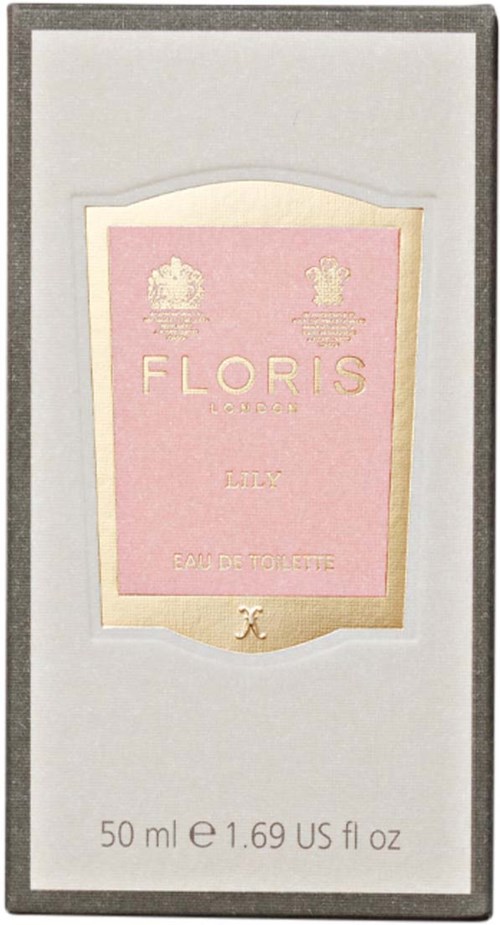 A perfume box with a pink label, gold accents, floral patterns, and text for Floris lily perfume inside a gray box.