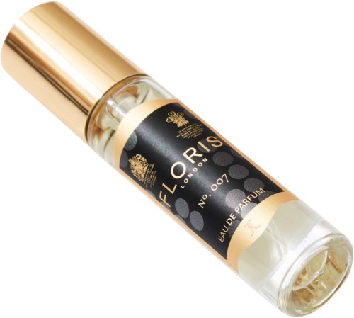 A small perfume roll-on bottle with black and gold label reading "F.LORIS London No.007 Eau De Parfum."
