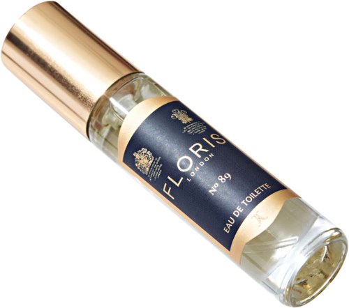 En liten parfymflaska med guldlock och mörkblå etikett som säger 'Floris London' och 'Eau de Toilette.'