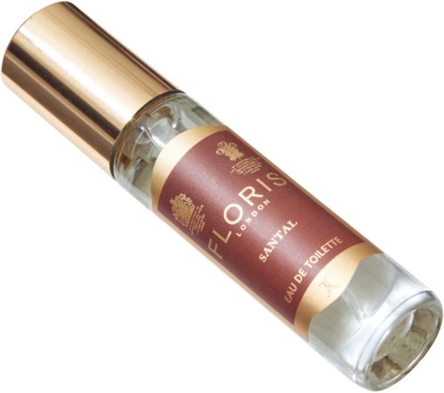 Mała butelka perfum z złotą nakrętką i brązową etykietą, na której jest napisane 'Eloris London Santal Eau de Toilette.'