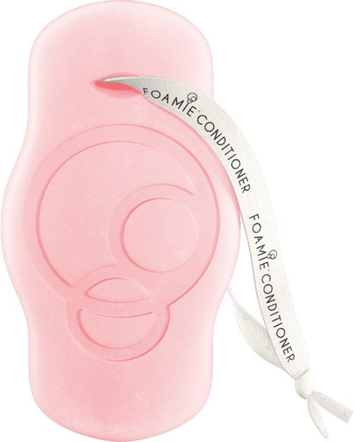 Klein roze draagbaar apparaat met een lint dat zegt 'Foamie Conditioner' en een kleine opening aan de bovenkant.
