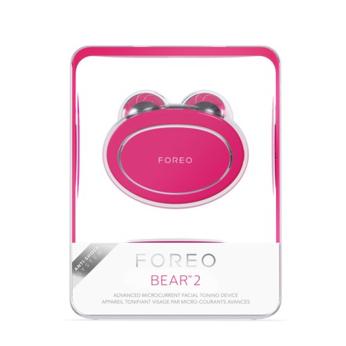 A pink device in box, labeled 'FOREO BEAR 2,' a facial toning gadget with two round metal heads.