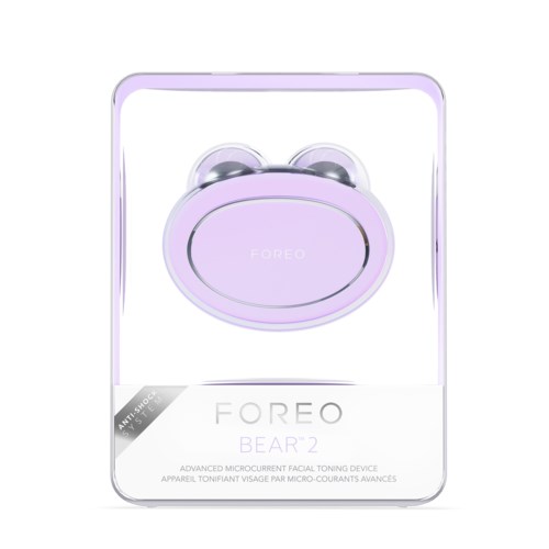 A purple facial device with two round attachments and a large oval center, in clear packaging.