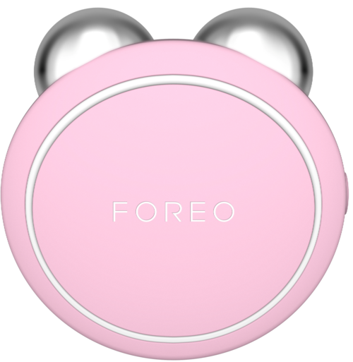 En rosa enhet med silverkulor och ordet 'FOREO' på, troligen ett skönhets- eller hudvårdsverktyg.