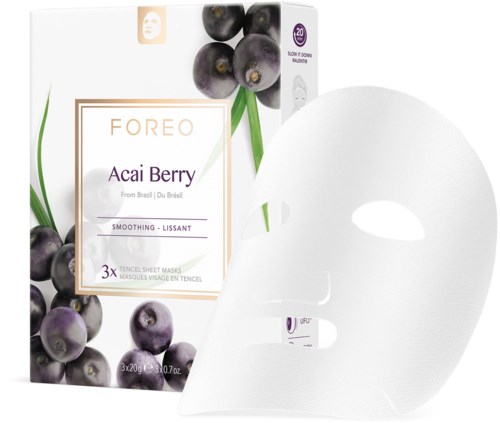 En eske med FOREO Acai Berry ansiktsmasker med blåbærillustrasjon og et hvitt ansiktsmaskeark ved siden av.