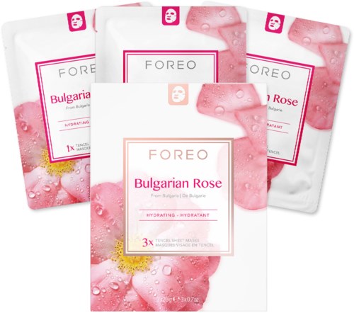 Tre paket av ansiktsmaske med etiketten Bulgarisk Ros, med rosa blommor och vattendroppar.