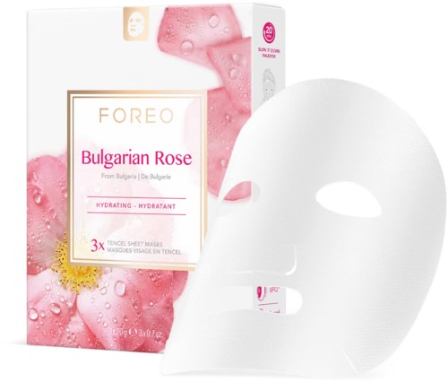 En vit ansiktsmask bredvid en låda märkt 'FOREO Bulgarian Rose', med rosa och rosenbilder, som visar hudvårdsprodukt.