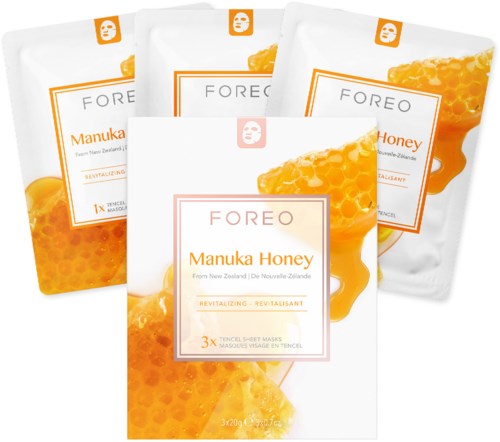 Vier Packungen Hautpflege-Masken mit Honig- und Bienenwabenbildern, beschriftet 'FOREO Manuka Honey' und 'Revitalizing'.