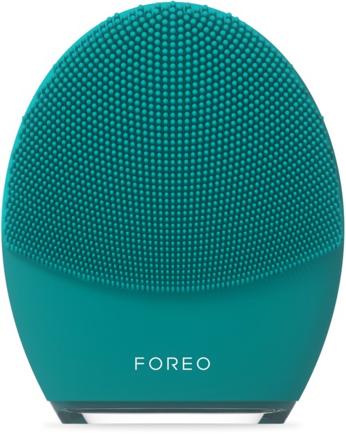 En teal, äggformad enhet med en texturerad yta och ordet 'FOREO' på.