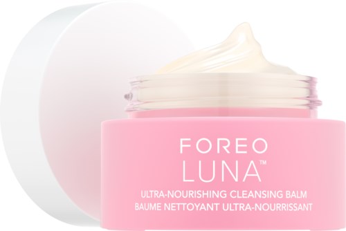 Różowa butelka kremu do skóry marki "Foreo Luna" z odrobiną kremu na wierzchu.