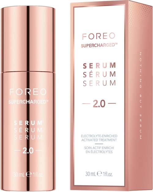 A pink bottle and box of FOREO Supercharged Serum 2.0 for skin care, 30 ml size.