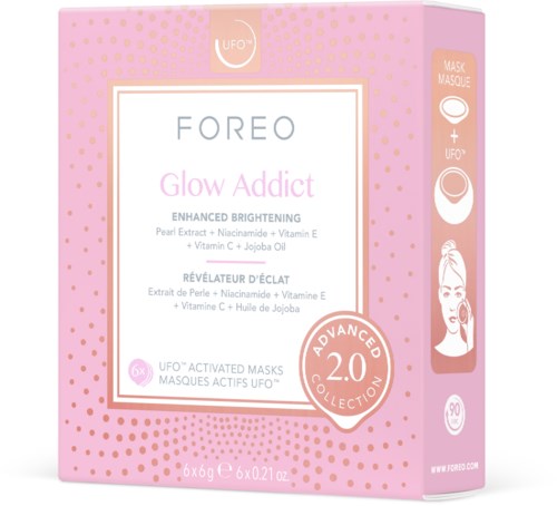 Różowe pudełko z złotymi kropkami zawiera maseczki twarzy Foreo Glow Addict do rozświetlenia skóry.