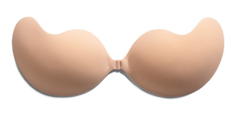 Ett beige, böjt föremål som liknar ett par stora, runda bröst med en mittdel. Det verkar vara en silikonprotes.