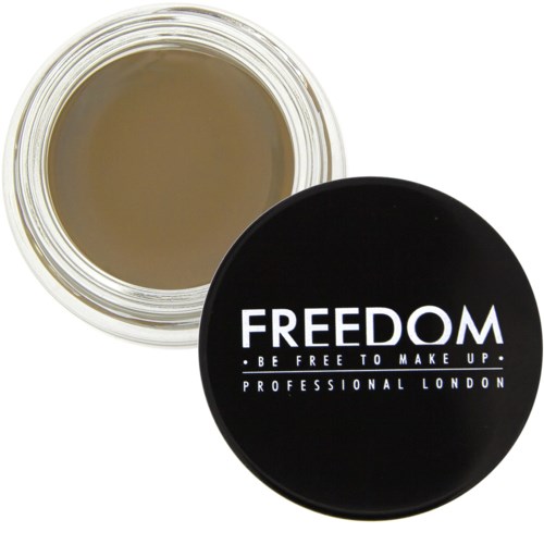 En rund beholder med svart lokk som viser ordene 'FREEDOM' og 'BE FREE TO MAKE UP' fra Professional London.
