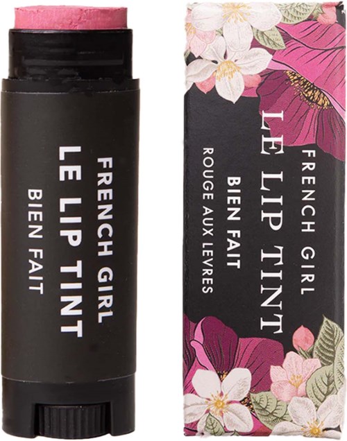 Lip balm in a black tube marked 'French Girl Le Lip Tint,' with floral packaging featuring pink and white flowers.