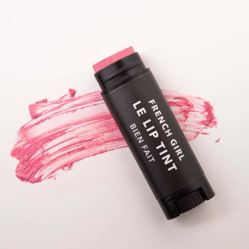A black lip tint tube with pink color on paper, labeled "French Girl Le Lip Tint" and "Biev Fait."