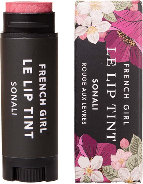 A lip balm tube and floral box with pink, purple, and white flower designs, and text about French Girl and lemon scent.