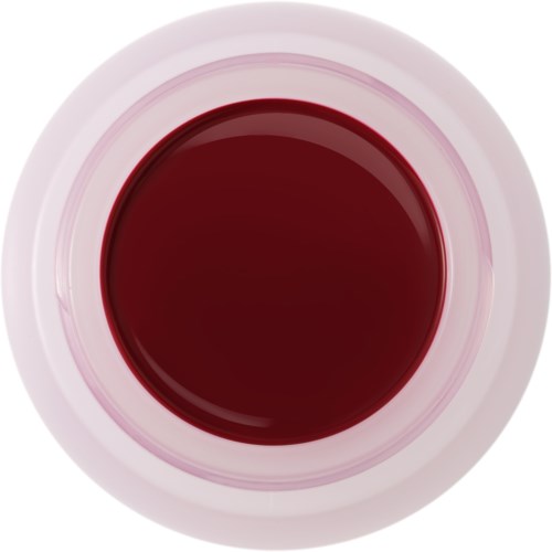 En toppvisning av en hvit kopp fylt med mørkerød væske, sannsynligvis te eller juice.