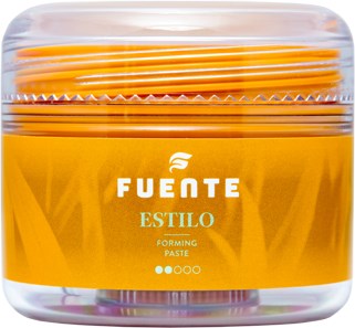 En transparent behållare med gul formningsmassa, bookletpinnar inuti, och en etikett som säger "Fuente Estilo".