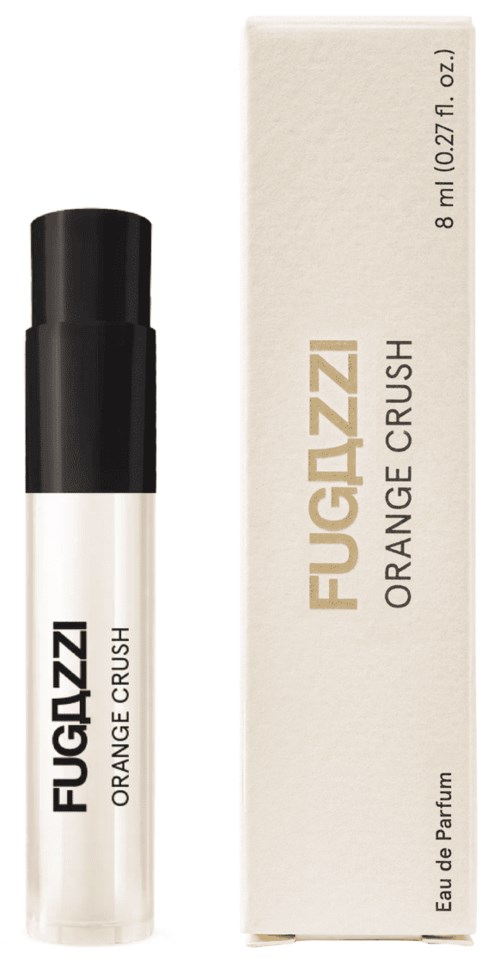 A perfume roll-on container with black cap next to a white box labeled "FUGAZZI ORANGE CRUSH".
